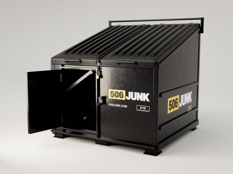 The front crew door of a black 6-yard bin swung open, with bags inside